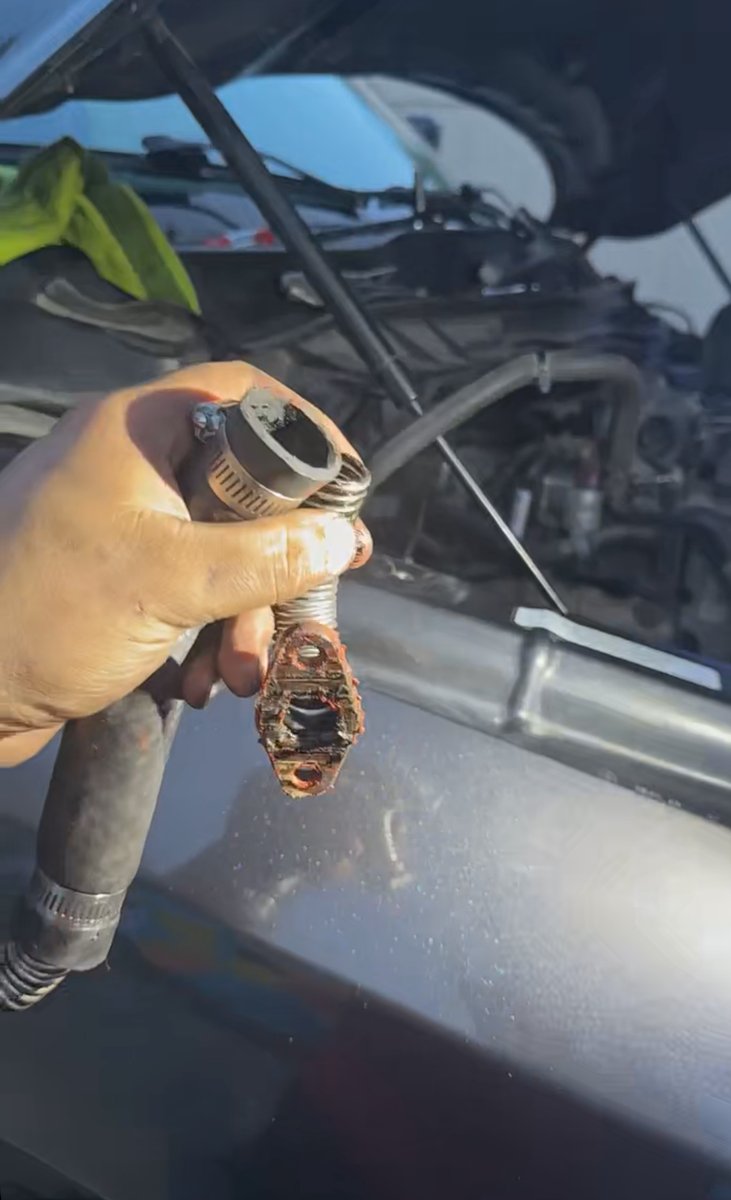 Turbo oil drain line cut and spliced back together with a hose clamp