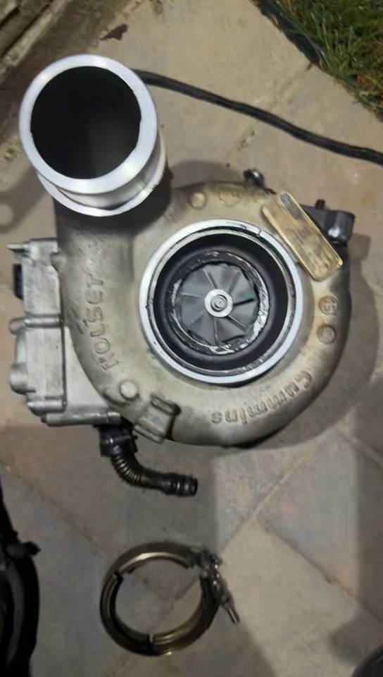 Used medium-duty Holset turbocharger sitting on pavement