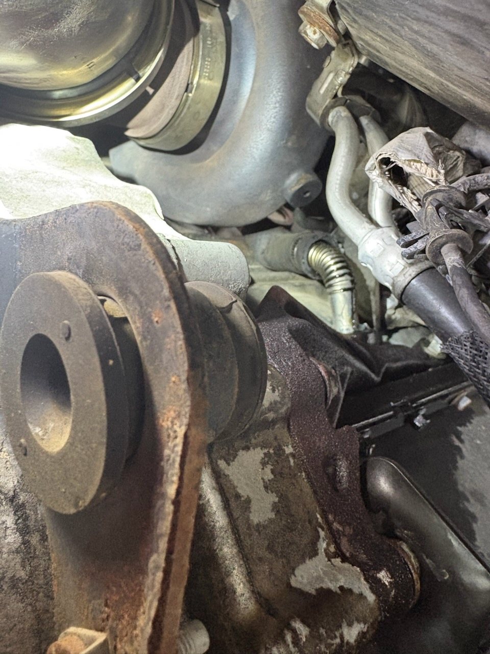 Turbo oil drain cut and spliced to a hose, leaking oil